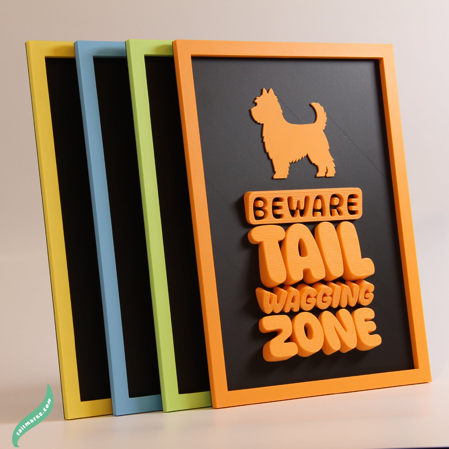 Four colors framed signs with dog-themed designs on a neutral background
