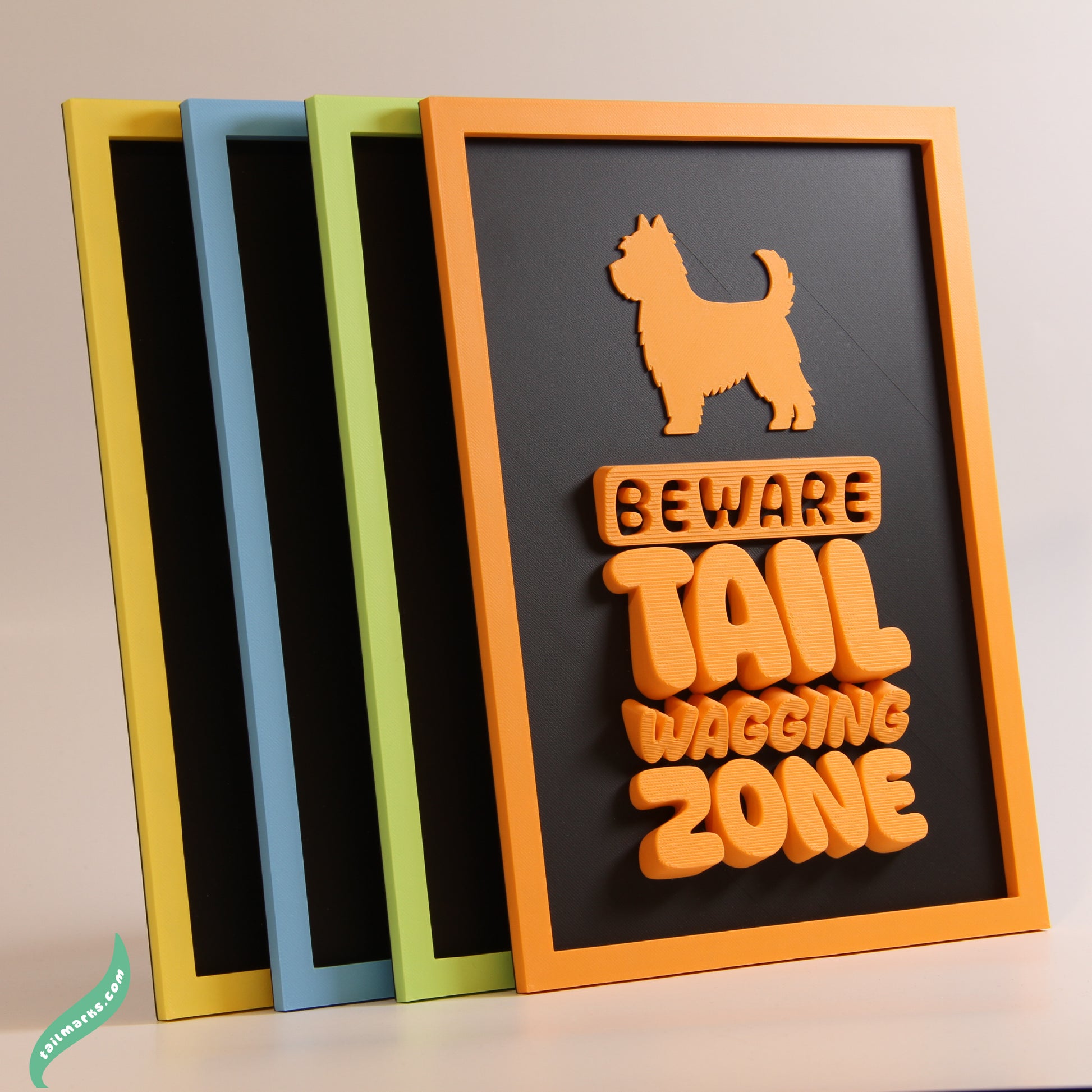 Four colors framed signs with dog-themed designs on a neutral background