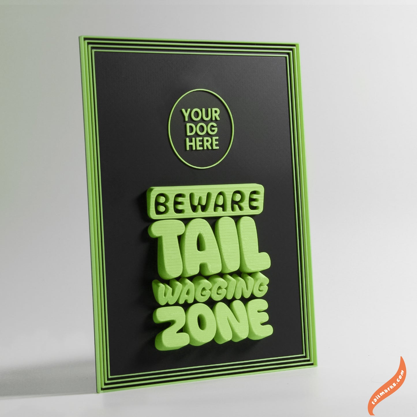Decorative sign with 'Beware Tail Wagging Zone' green text and a focus frame on a black background