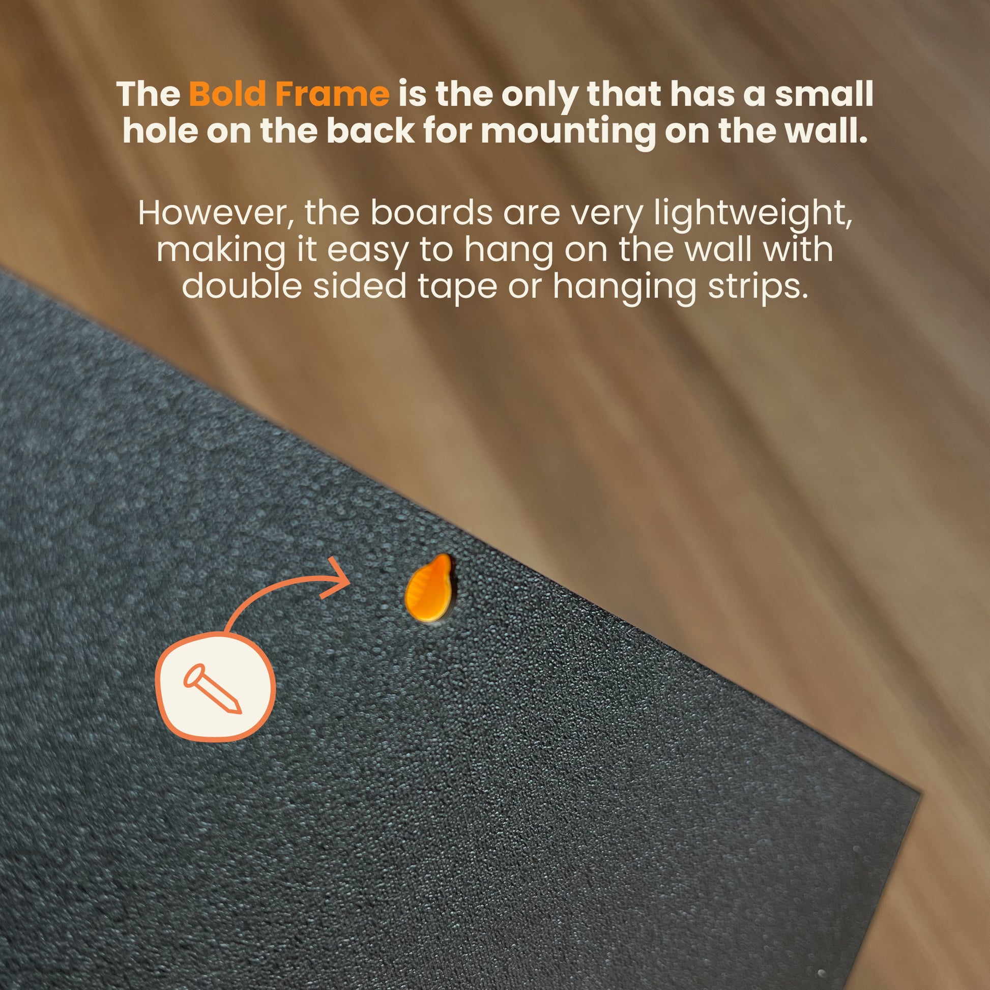 Text on a black board with mounting instructions and a small hole for wall mounting.