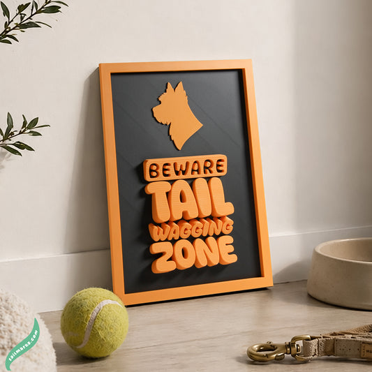 Framed dog sign with 'Beware Tail Waving Zone' text on a wall with pet accessories below.