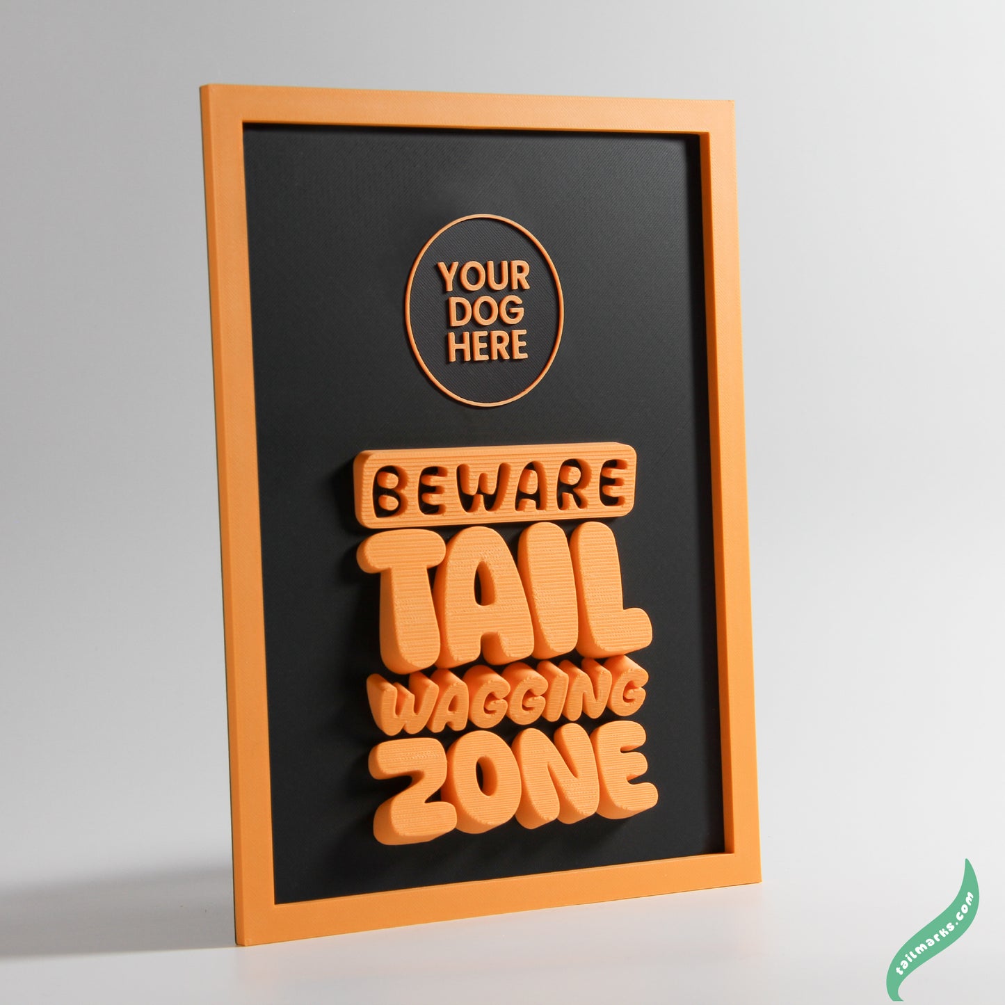 Framed artwork with text 'Beware Tail Wagging Zone' and space for 'Your Dog Here' on a grey background.